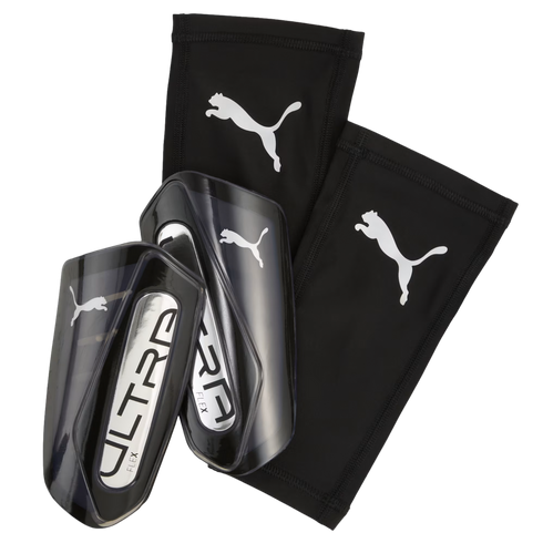Pair of black and silver Puma Ultra Flex shin guards with matching black compression sleeves featuring white Puma logos.