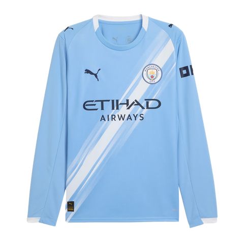 Long-sleeved light blue Manchester City Puma soccer jersey featuring a diagonal white sash, the club crest, and Etihad Airways sponsor logo.