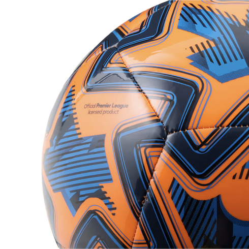 A close-up of a glossy orange and blue soccer ball with geometric patterns and the text "Official Premier League licensed product."