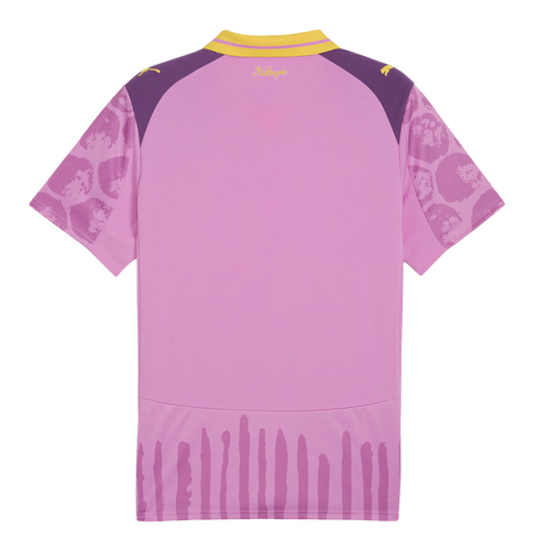 Back of a pink jersey with purple shoulders, yellow collar, and yellow branding. Includes patterned sleeves and vertical purple brushstroke-style stripes along the bottom hem.