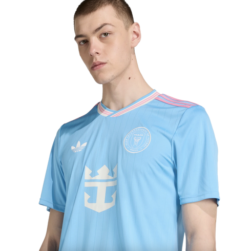 Man wearing a light blue Inter Miami CF third jersey with pink and white trim and Royal Caribbean sponsor logo.