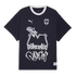 Black Puma Rayados t-shirt with white graffiti-style "M" and "Rayados" graphics. Features the team crest and a white crew neck.
