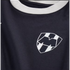 Close-up of a navy blue jersey with a white collar. On the chest is the C.F. Monterrey shield crest, featuring a stylized 'M' over vertical black and white stripes.