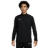 A young man with curly hair and freckles wearing a black Nike quarter-zip long-sleeve athletic top and matching black pants, standing against a white background.