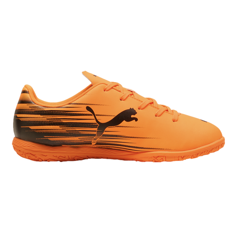 Bright orange Puma indoor soccer shoe featuring a black leaping cat logo and graphic speed lines, shown against a solid black background.