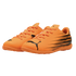 Pair of bright orange Puma indoor soccer shoes with black graphic details and logos, set against a black background.