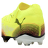 Rear side view of a neon yellow Puma soccer cleat featuring a black cat logo, curved pink and black stripes, and a white sole with clear studs.