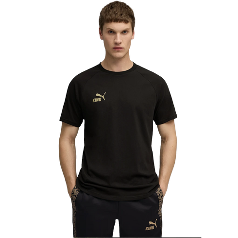 A man in a black Puma "King" t-shirt and matching shorts with gold logos, standing against a black background.
