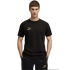 A man in a black Puma "King" t-shirt and matching shorts with gold logos, standing against a black background.