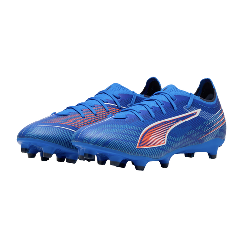 Pair of blue Puma soccer cleats with orange and white accents and molded studs on a black background.