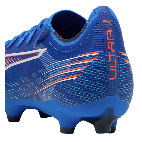 Rear view of a blue Puma Ultra soccer cleat featuring orange "ULTRA" text on the heel and white and orange stripe accents on a textured upper.