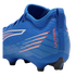 Side profile of a royal blue Puma Ultra soccer boot with orange "ULTRA" text, white and red graphic stripes, and a black-tipped studded sole.