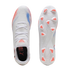 Top and bottom views of white Puma soccer cleats with red and blue accents and bright pink studs on the sole.