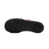 Bottom view of a black studded outsole of a pink Nike turf soccer shoe with a large Nike swoosh logo in the center.