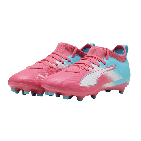 A pair of pink and light blue Puma soccer cleats with white accents, shown against a solid black background.