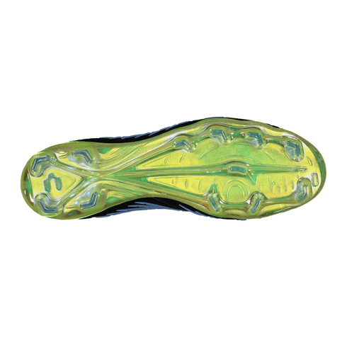 Bottom view of an iridescent lime green soccer cleat soleplate featuring blue chevron-shaped studs against a solid black background.