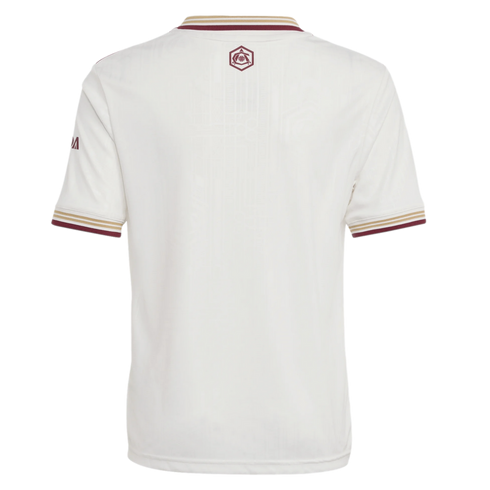 Back view of an off-white sports jersey with burgundy and gold striped cuffs and collar. A small burgundy crest is centered on the upper back.