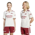 A girl and a boy smiling while wearing white and maroon Arsenal football kits against a black background.