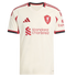 Cream Liverpool F.C. football jersey with red and black trim. Features the Adidas logo, team crest, and Standard Chartered sponsor logo on the front.