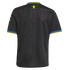 Back view of a black jersey featuring blue and yellow striped trim on the collar and sleeves, a subtle tonal vertical pattern, and a small yellow logo below the neck.