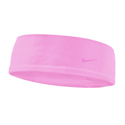 A light pink Nike fleece headband with a small matching swoosh logo on the right side, set against a black background.