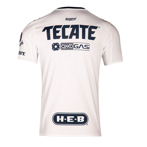 Back view of a white Rayados soccer jersey with navy blue sponsor logos for Tecate, Oxxo Gas, and H-E-B on a black background.