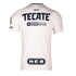 Back view of a white Rayados soccer jersey with navy blue sponsor logos for Tecate, Oxxo Gas, and H-E-B on a black background.