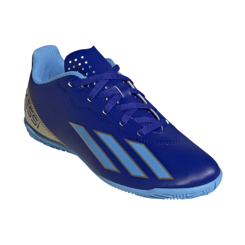 A royal blue Adidas indoor soccer shoe featuring three light blue diagonal stripes and "Messi" branding on the heel.