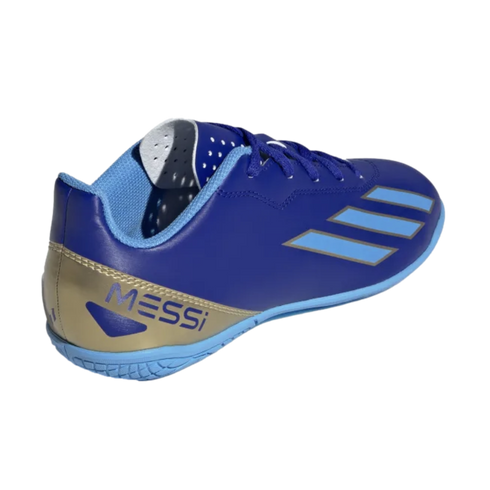 A blue Adidas soccer shoe with "MESSI" in blue on a gold heel. It has light blue stripes and sole, shown against a black background.