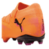 Bright orange Puma soccer cleat with a black cat logo, pink accents, and black studs with purple tips. The heel features the text "PLAY FREE FUTURE."