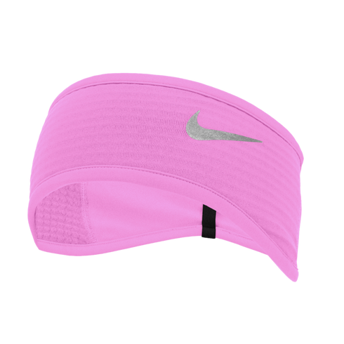 A bright pink Nike athletic headband with a reflective silver swoosh logo, contoured for ear coverage, set against a black background.