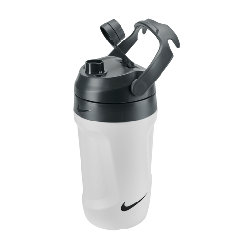 White Nike water bottle with a black lid and handle. Features a textured grip, open flip-top cap, and the Nike swoosh logo. Set against a black background.