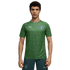 A man wearing a green, patterned Manchester City training jersey and dark green shorts.
