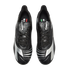 Overhead view of black and silver Diadora soccer cleats with fold-over tongues against a black background.