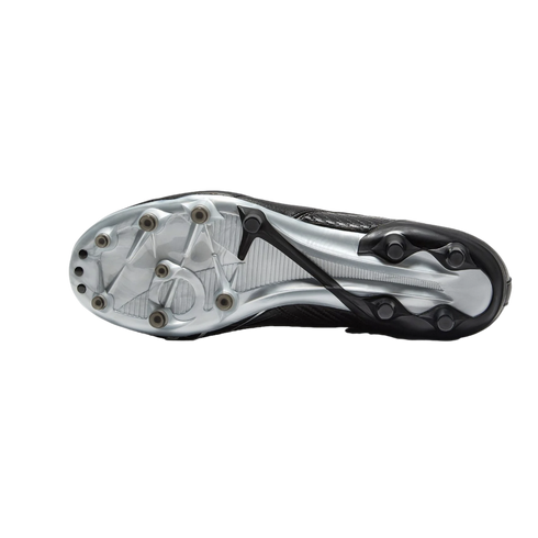 Bottom view of a soccer cleat's metallic silver and black soleplate, featuring a variety of studs for traction.
