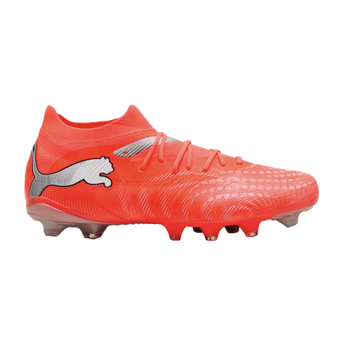 A bright orange Puma soccer cleat with a silver leaping cat logo, shown from the side against a black background.