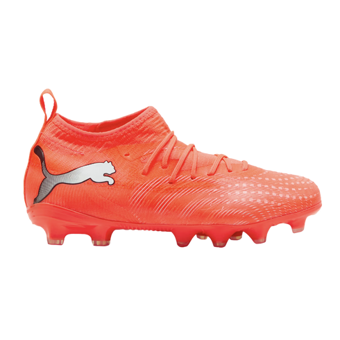 Side profile of a bright orange Puma soccer cleat with a white logo on the heel, textured upper, and studded sole against a black background.