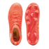 Top and bottom views of a bright orange Puma soccer cleat. Features include a textured upper with white dots, matching laces, and a studded outsole with a swirling pattern.