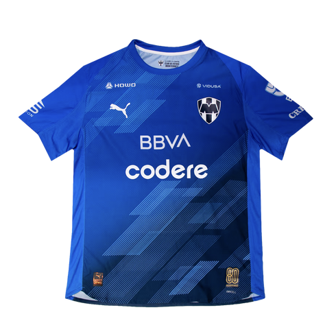 A royal blue CF Monterrey soccer jersey by Puma with dark blue diagonal patterns, featuring the club crest, BBVA and Codere logos, and a gold 80th-anniversary badge.