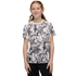 A smiling girl with red hair wears a Manchester City Etihad Airways t-shirt featuring a black and white graphic print against a black background.