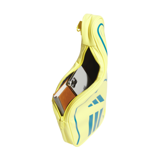 A yellow Adidas bag against a black background, zipped open to show a white smartphone and a brown notebook inside.
