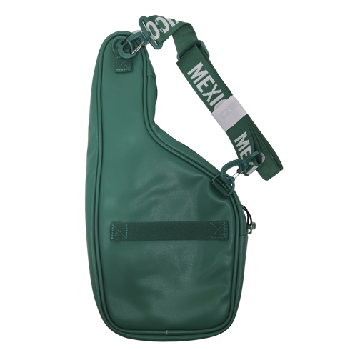 A dark green asymmetrical sling bag with a wide woven strap featuring "MEXICO" in white text, set against a solid black background.