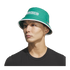 Man wearing a green bucket hat with white "MEXICO" text and a black t-shirt against a black background.