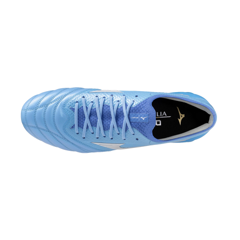 Top-down view of a light blue Mizuno soccer cleat with matching laces and a textured upper, set against a solid black background.