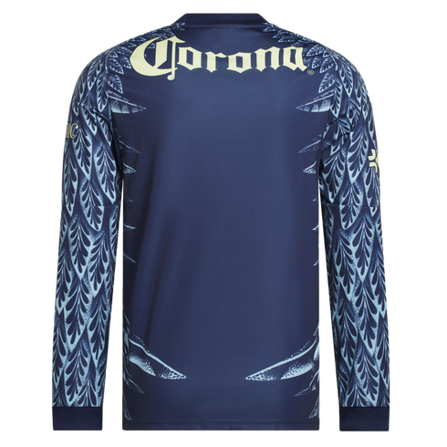 Back of a navy soccer jersey with a cream "Corona" logo and light blue feather patterns on the sleeves and lower sides.
