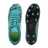 Top and bottom views of a teal Puma soccer cleat with comic-style graphics and stars. The black sole features teal studs, and the shoe's interior is bright lime green.