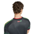 Back view of a person wearing a black Jamaica soccer jersey with "REGGAE BOYZ" text and red, yellow, and green accents on the shoulders.