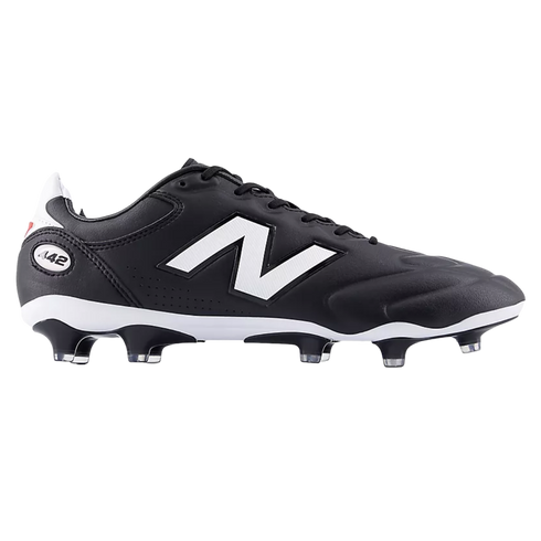 A side view of a black New Balance 442 soccer boot featuring a large white logo, a white midsole, and black studs with clear tips against a solid black background.