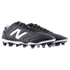 A pair of black and white New Balance soccer cleats featuring the iconic white "N" logo on the side and a studded outsole, set against a black background.