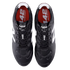 A pair of black New Balance 442 soccer cleats from a top-down perspective, featuring white logos and red insoles with white text.